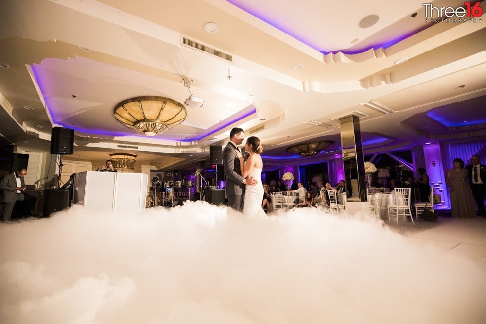 Bride and Groom dance with fog on the dance floor