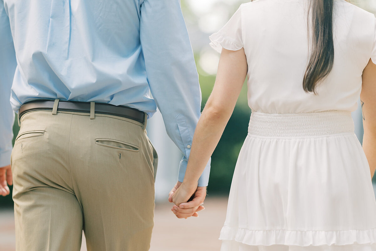 couple-holding-hands-for-engagement-photos