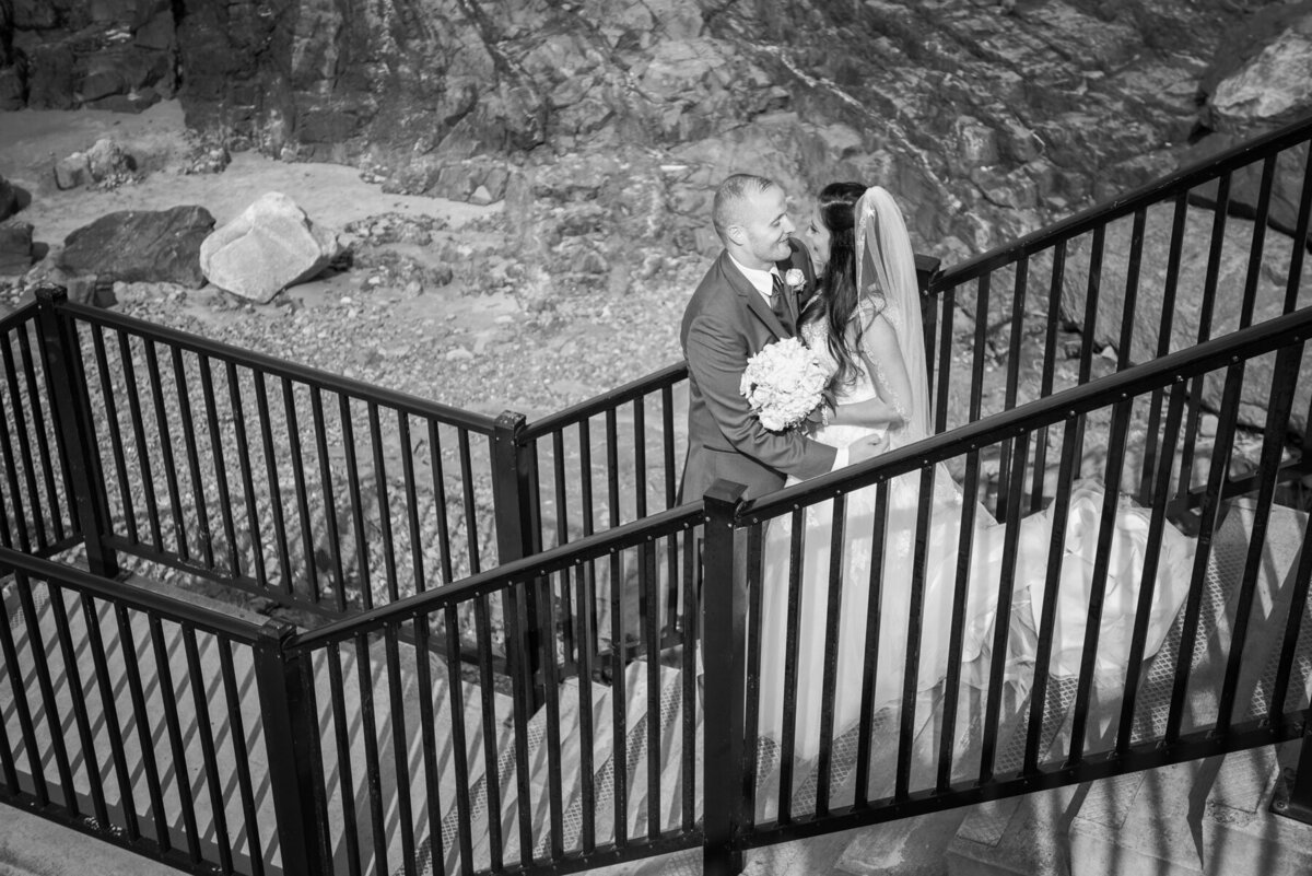 Bride and groom on staircase on Marginal Way Ogunquit Maine