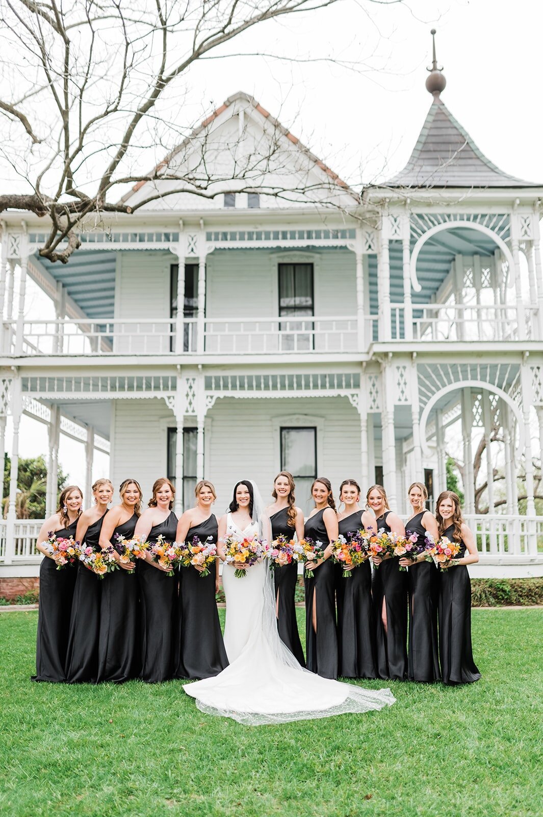 all-black-bridesmaid-dresses-front-of-barr-mansion