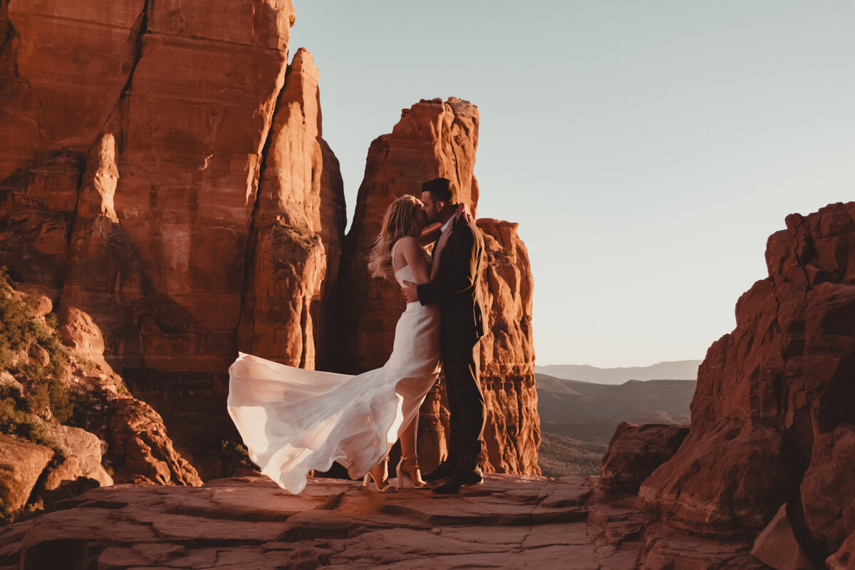Bride and groom silhouette against Sedona sunset taken by Kollar Photography