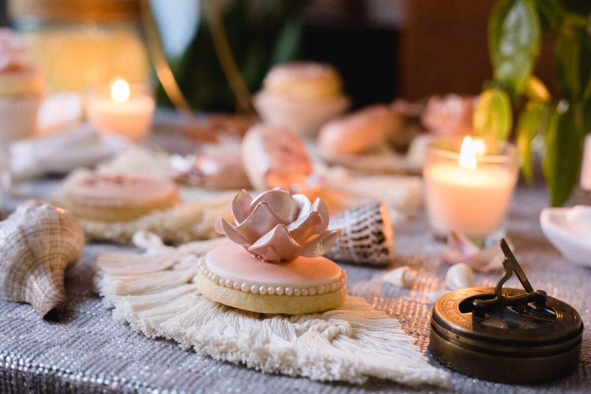 Pink iced biscuit with sugar rose