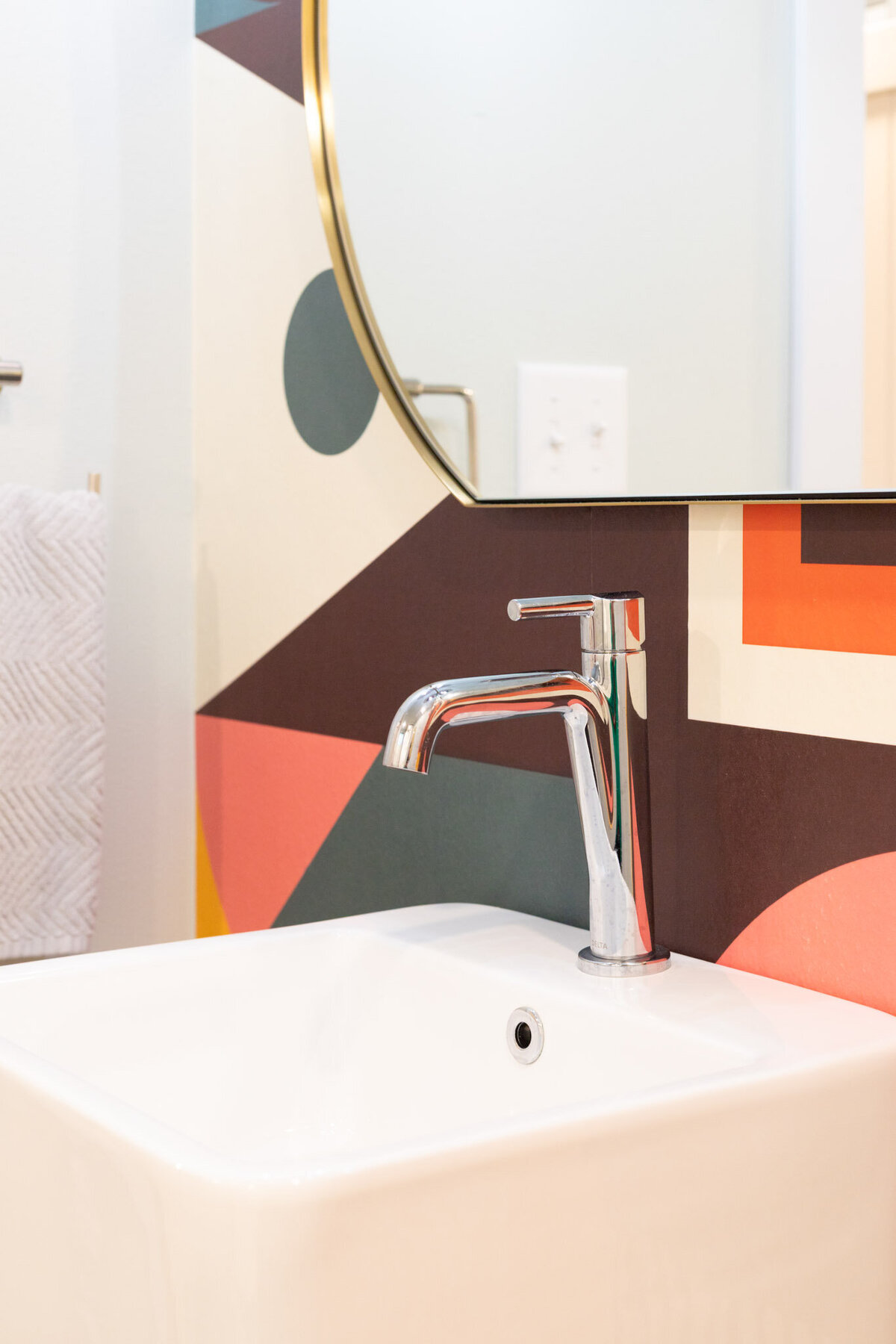 colorful wallpaper behind sink