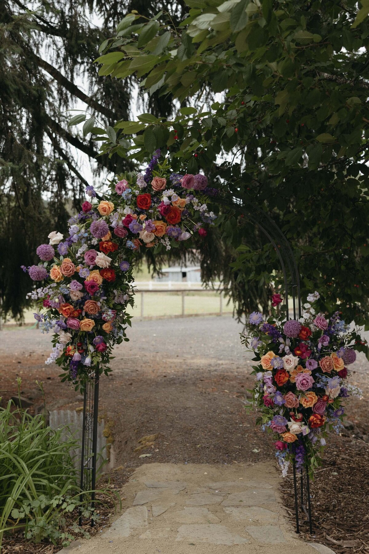 A wedding floral arch by Flowers and Thyme.