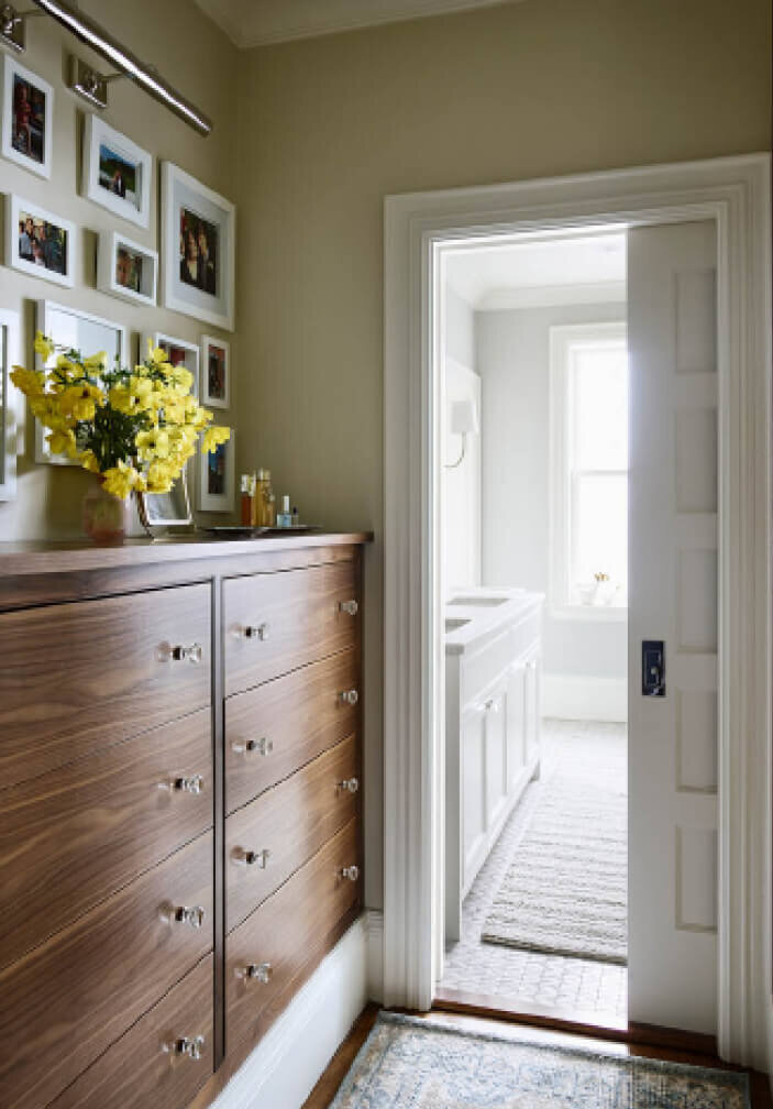 Boston Kitchen and Bath Designer designed a custom walnut dresser with glass knobs in a brownstone renovation project in the South End.