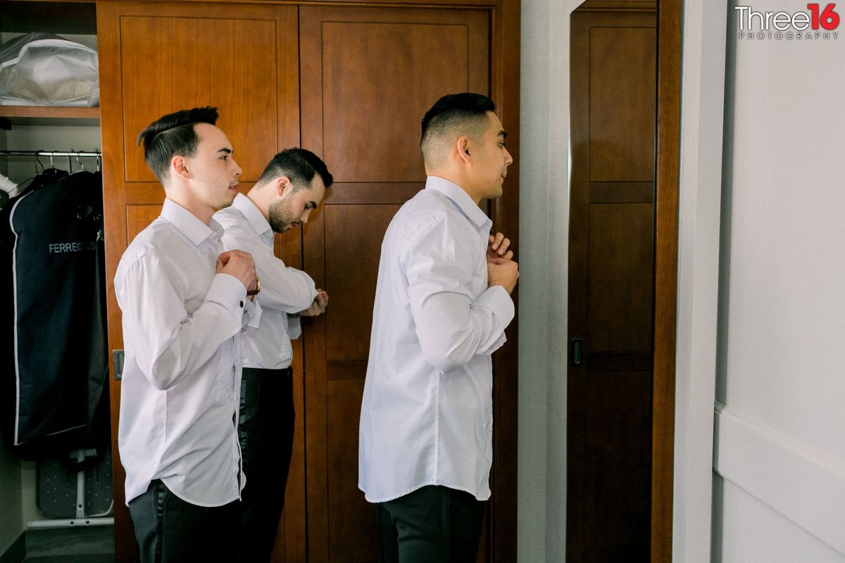 Groom and Groomsmen getting dressed before the wedding ceremony