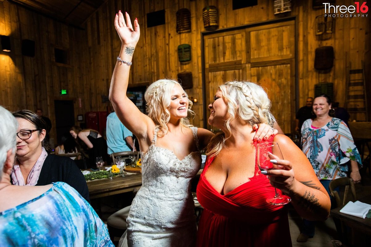 Bride dancing with a bridesmaid