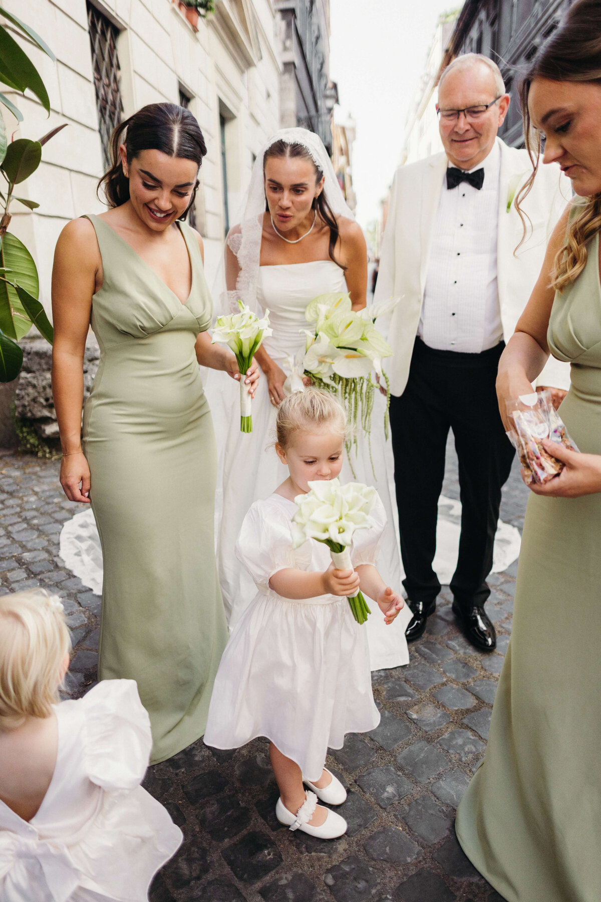 Bridal party walking through the streets of Rome to the ceremony

