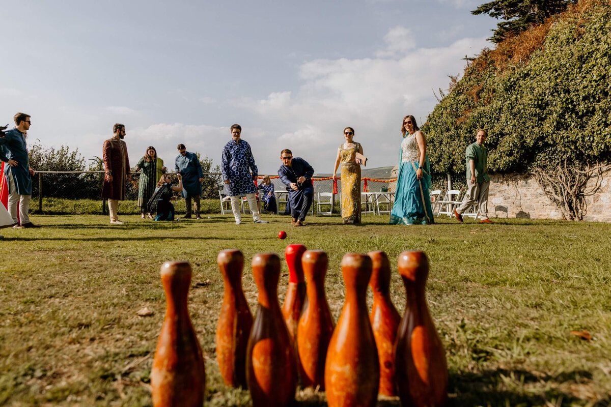 A group of people playing a game of bowling