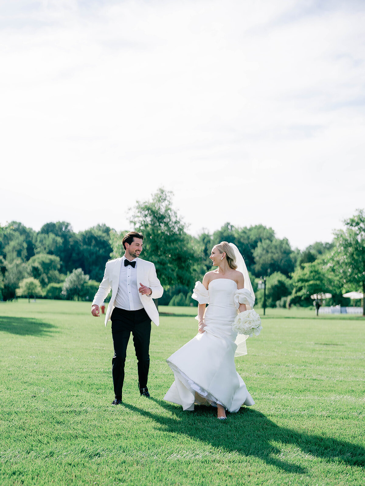 Couple runs together in their wedding day attire