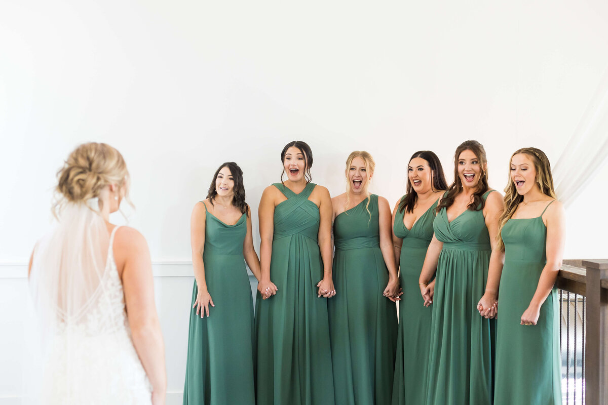 Brides first look with bridesmaids