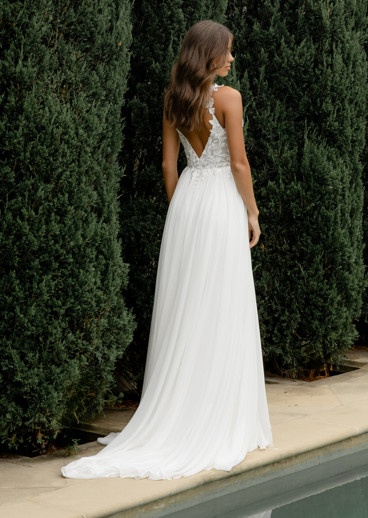 Back of wedding dress by the pool