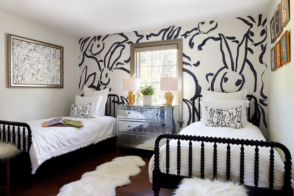 two single beds with black and white accent