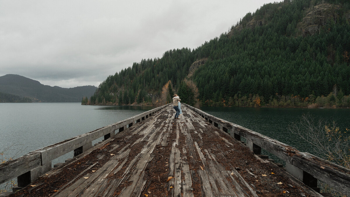 Couple on a trestle bridge in Campbell River during their engagement session by latitude 49 photography