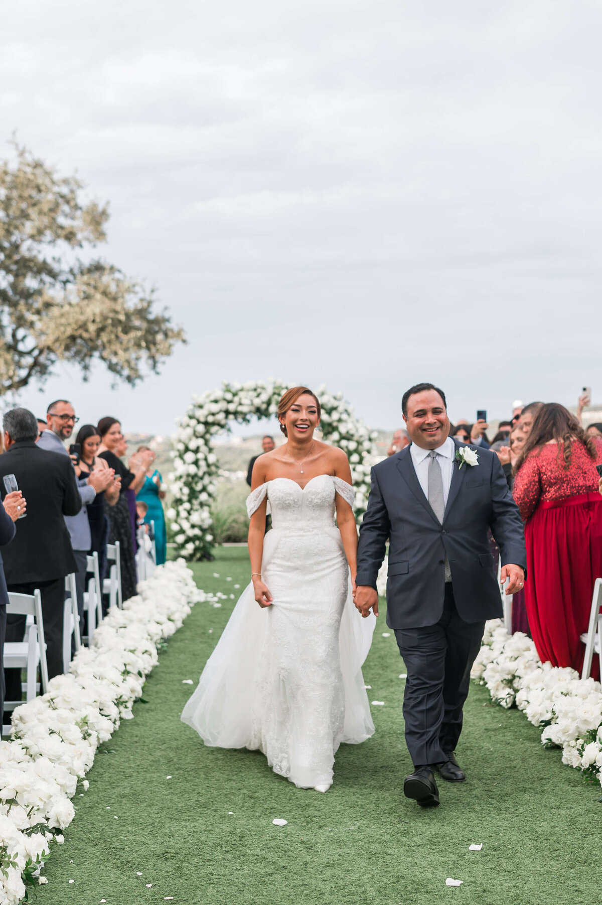 bride and groom walk down the aisle after being married in austin texas