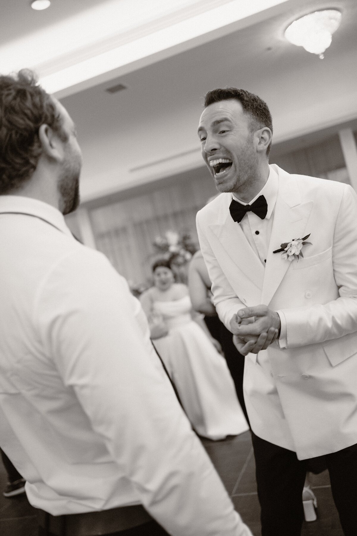 groomsman making the groom laugh