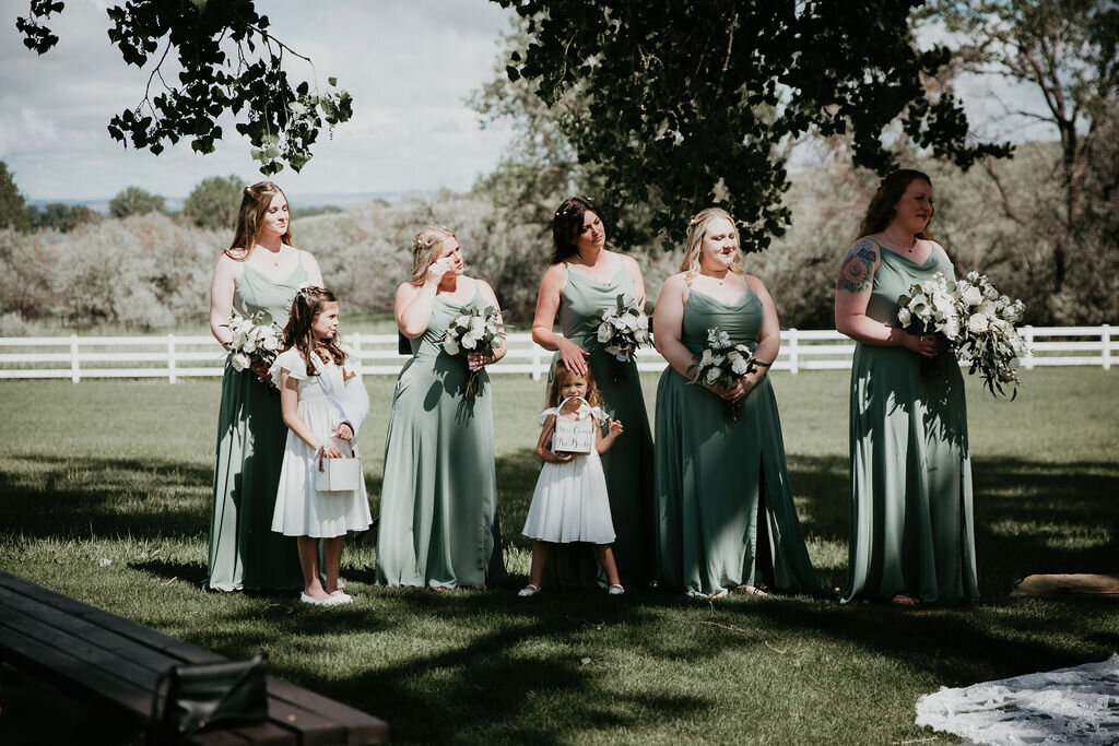 Bridal party watch as the bride and groom get married