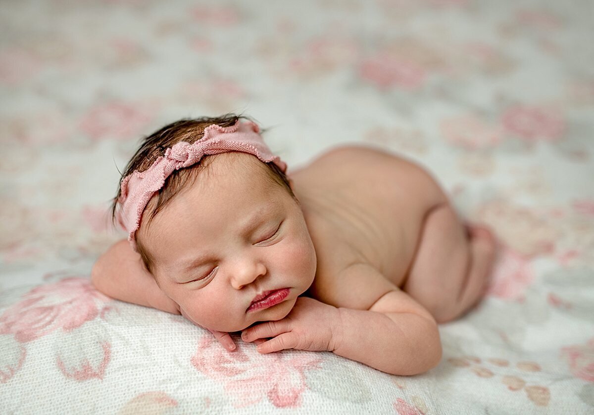 newborn-girl-on-floral-backdrop
