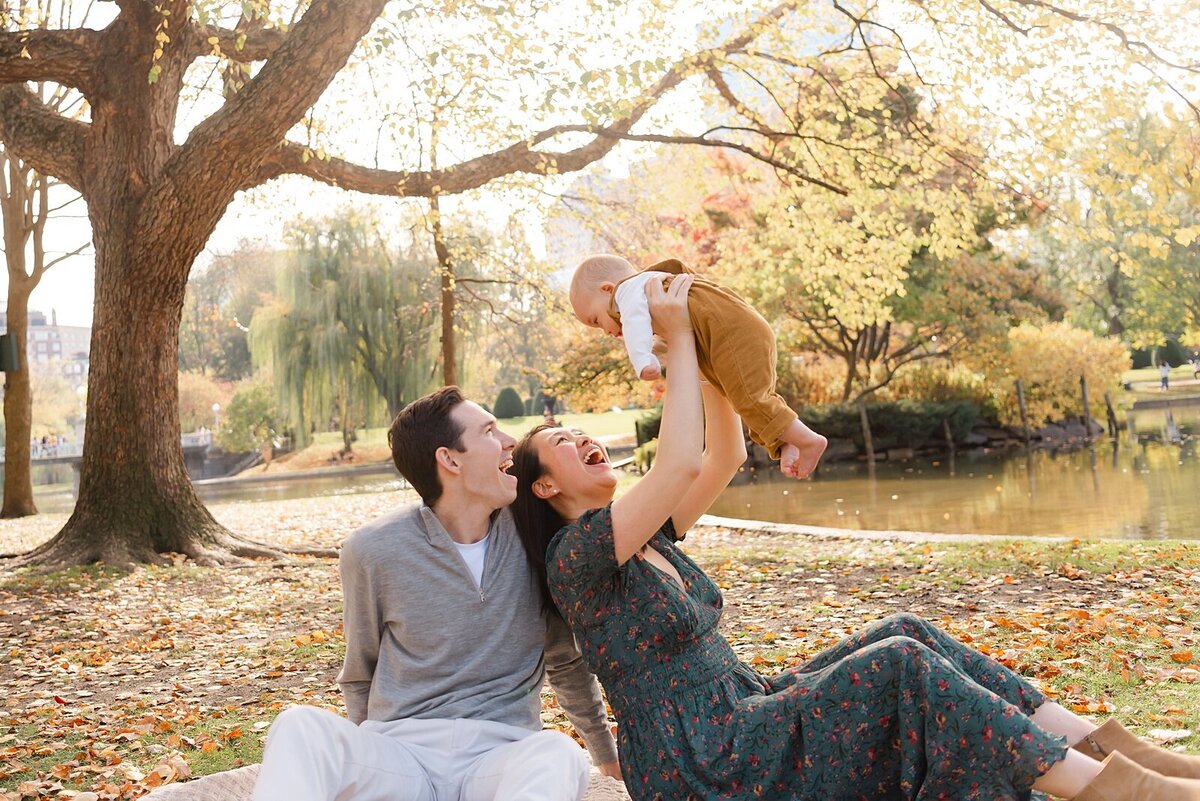 family surrounded by trees taken by boston area family photographer​