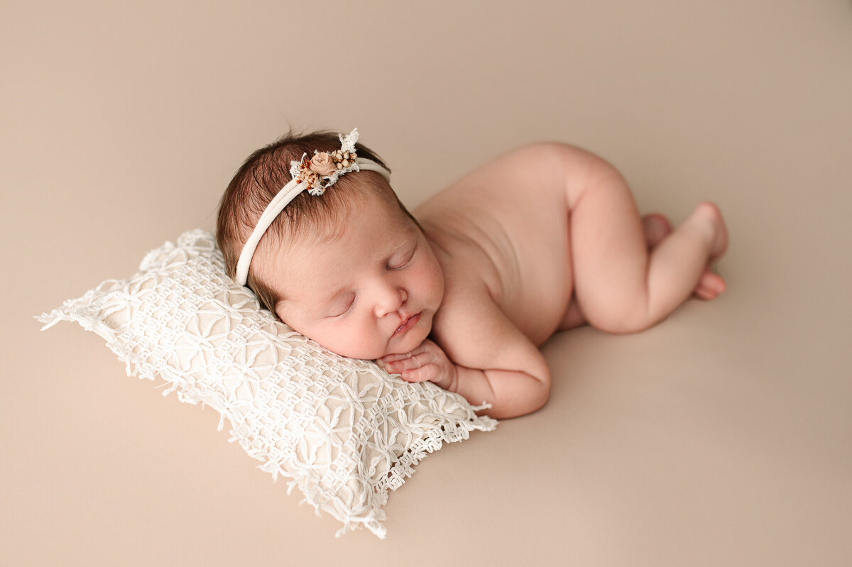 Newborn baby girl sleeping studio luxury natural light session