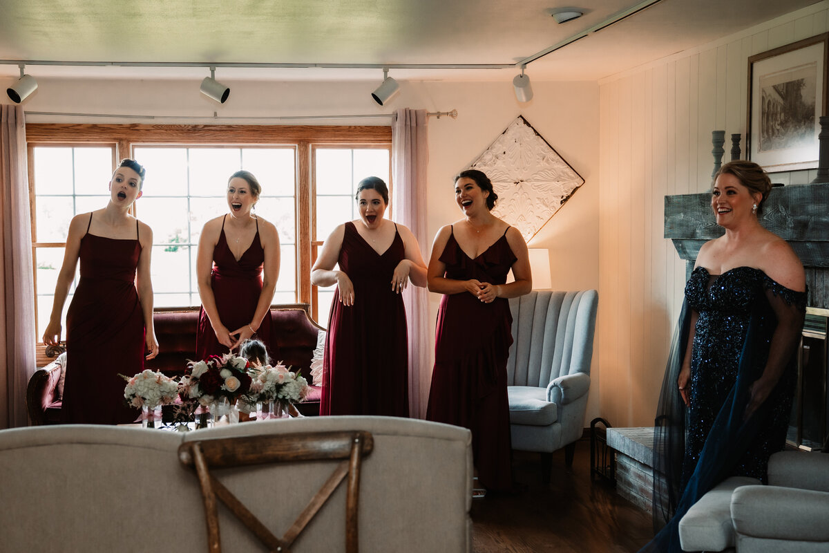 Bridesmaids react to dress reveal in getting ready room