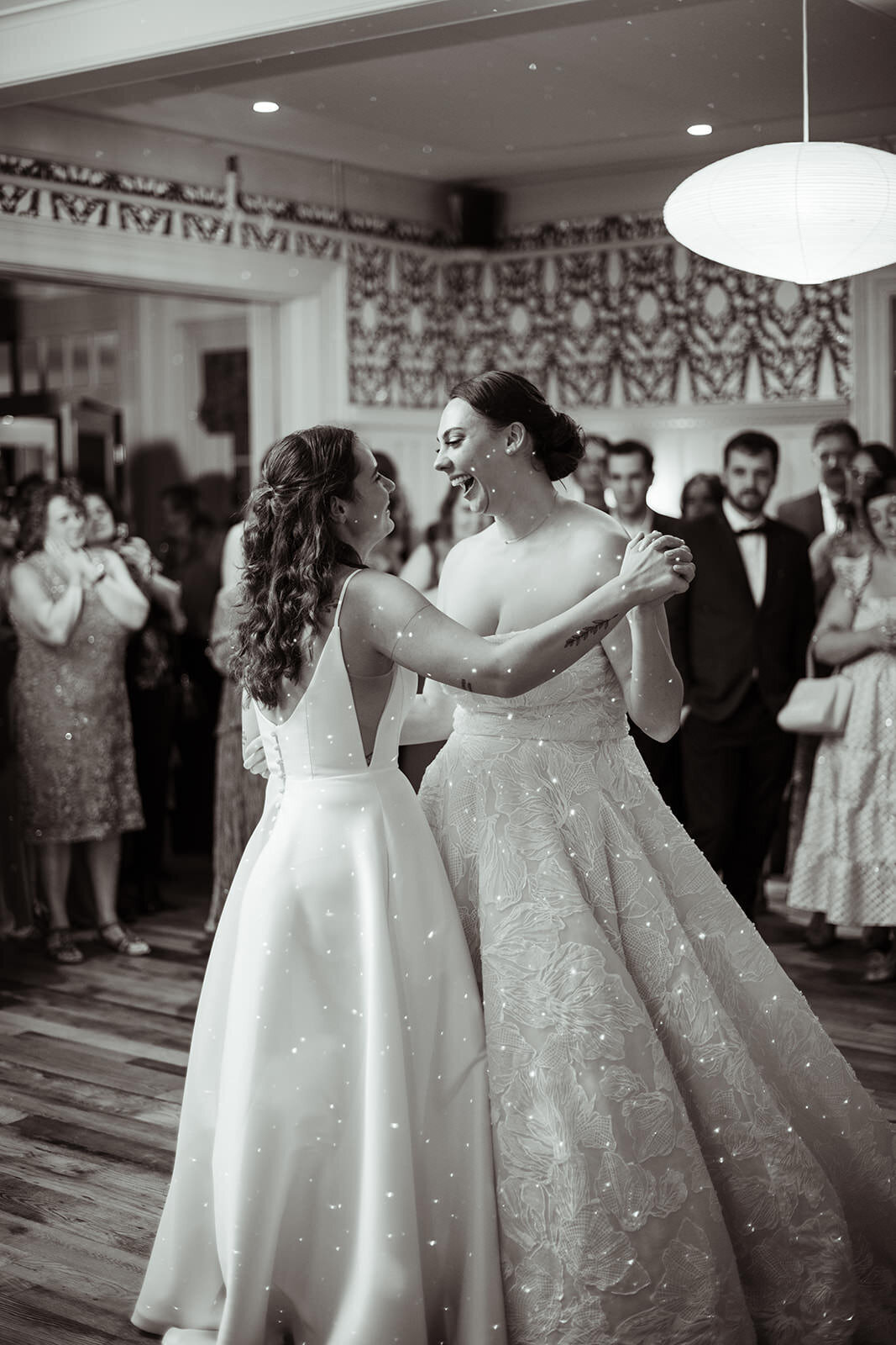 Brides dancing on the dance floor smiling
