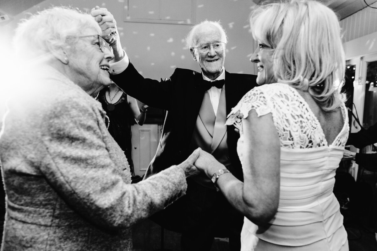 Black and white photo of Bride and Groom’s parents and grandparents dancing