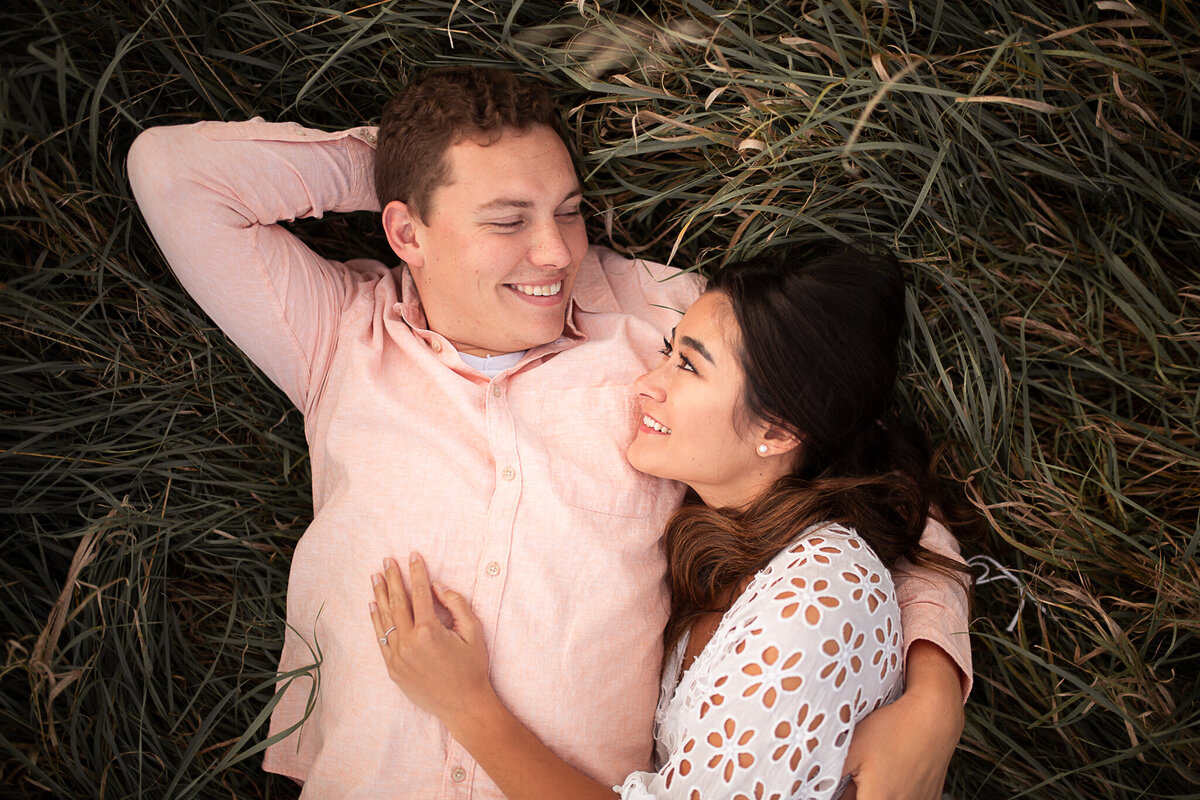engagement-session-hugging-nature-laying