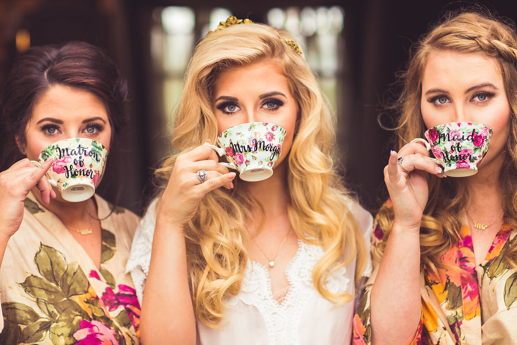 Wedding Photograph Of Bride and Bridesmaid Drinking From Teacup Los Angeles