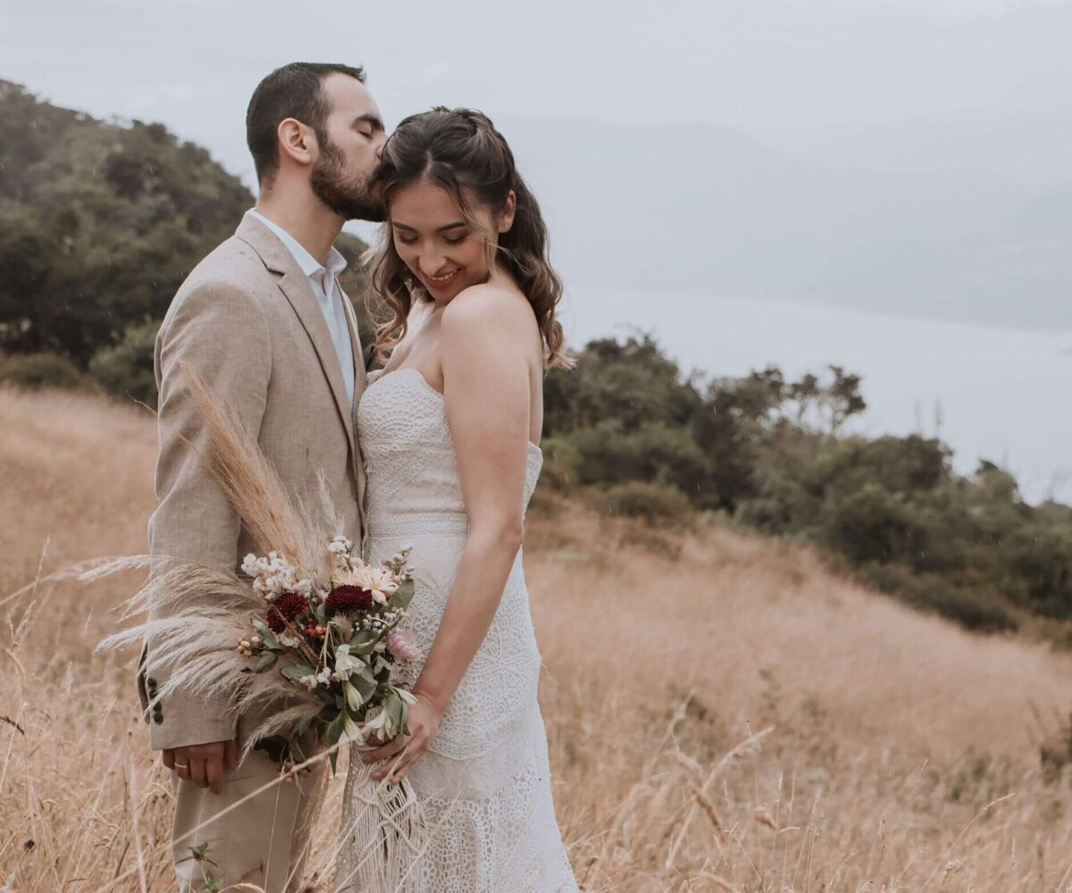Newlywed Couple Posing Outdoors