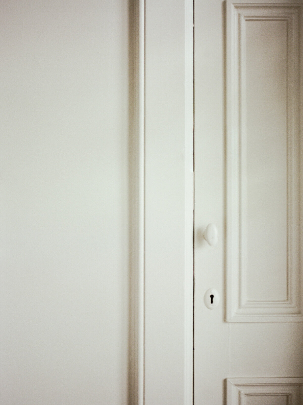 white, cream historic details, door with character, historic interior design at ALEO Detroit