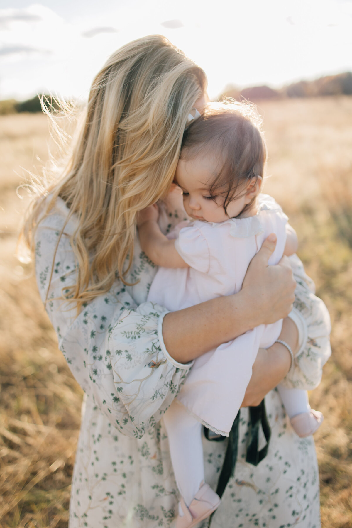 A golden fall family session with a one-year old girl. Session located in Flower Mound, TX.