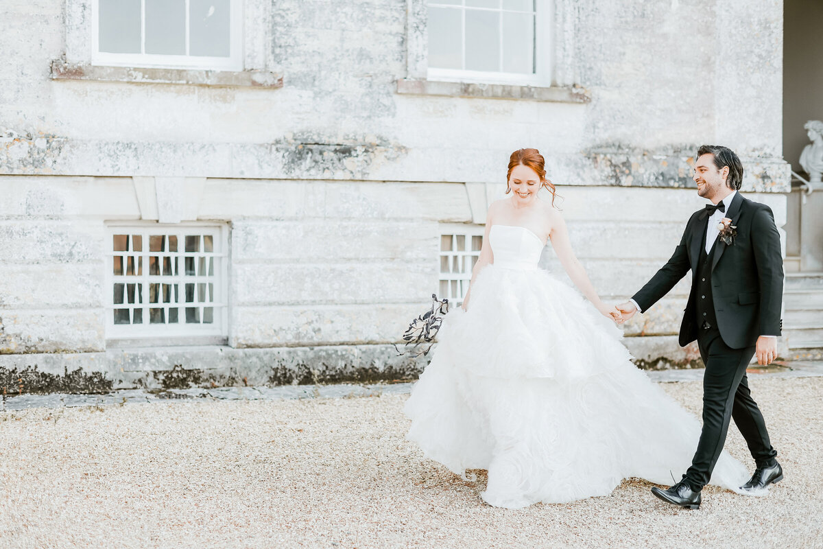 Came-House-wedding-venue-Dorset-bride-and-groom-walking