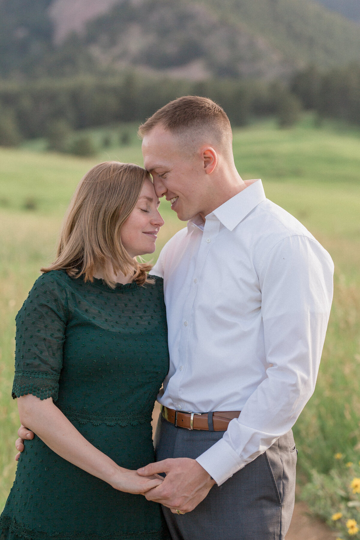 A couple share a romantic embrace during their engagement photos