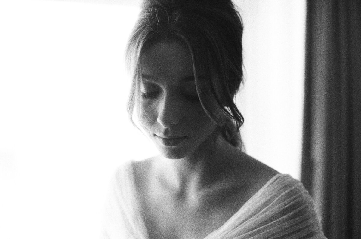 Black and white film image of a bride on her wedding day