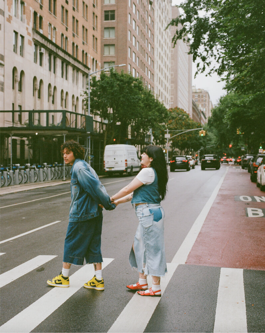 couples walks across new york city crosswalk wearing streetwear by huntsville alabama photographers