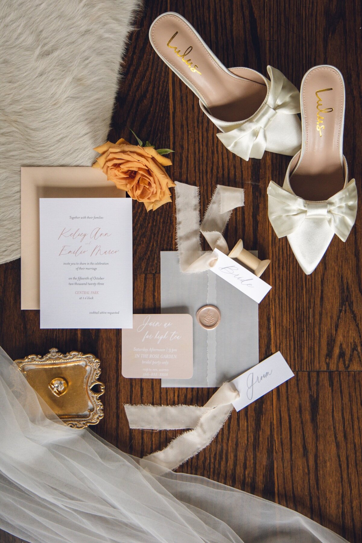 Styled flat lay with heirloom jewelry and wedding shoes