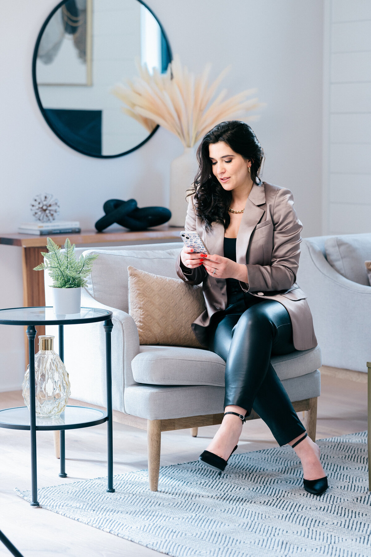 realtor-checking-phone-in-living-room