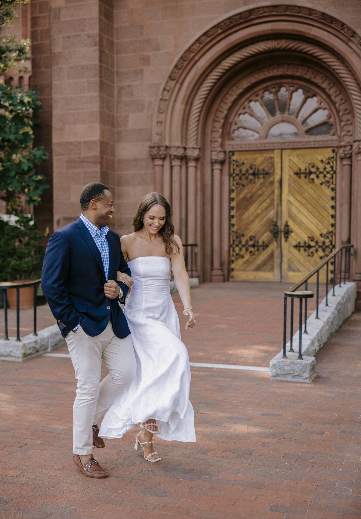 multi-racial-jubilant-couple-running-in-front-of-smithsonian