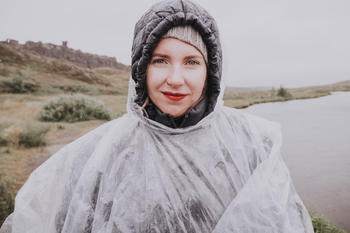 Portrait of woman wearing rain cover standing in Iceland