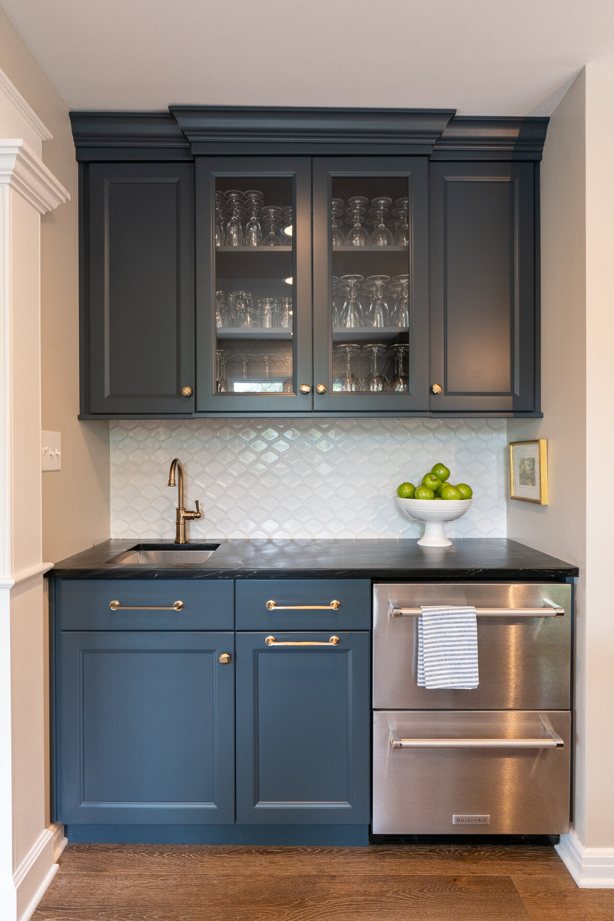 kitchenette with blue cabinets and stainless steel appliances