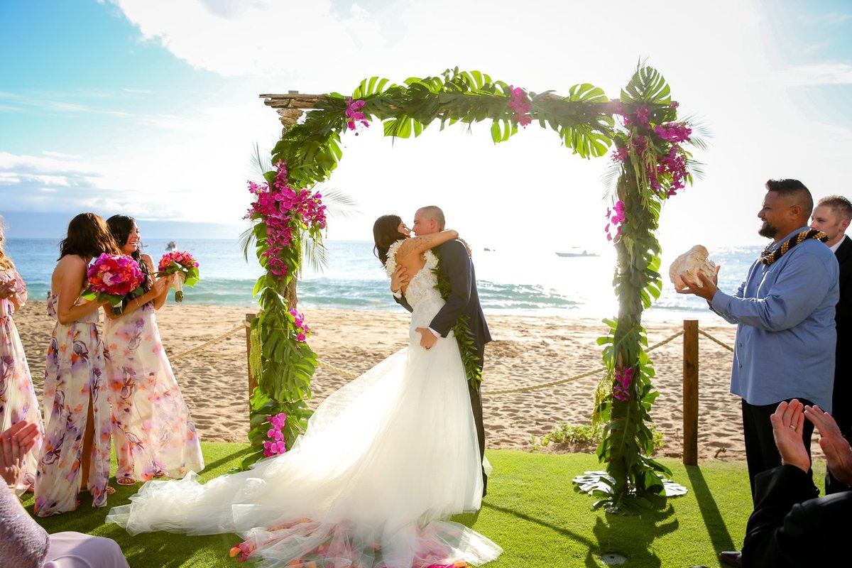 Maui Wedding Photography at The Westin Maui Resort and Spa with bride and groom kissing at the end of the ceremony