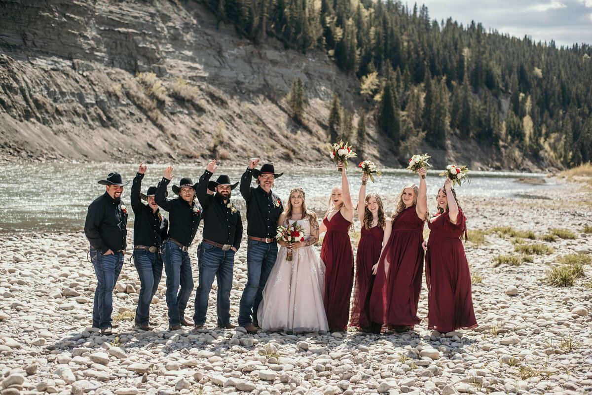 Bridal party with bride and groom celebrate