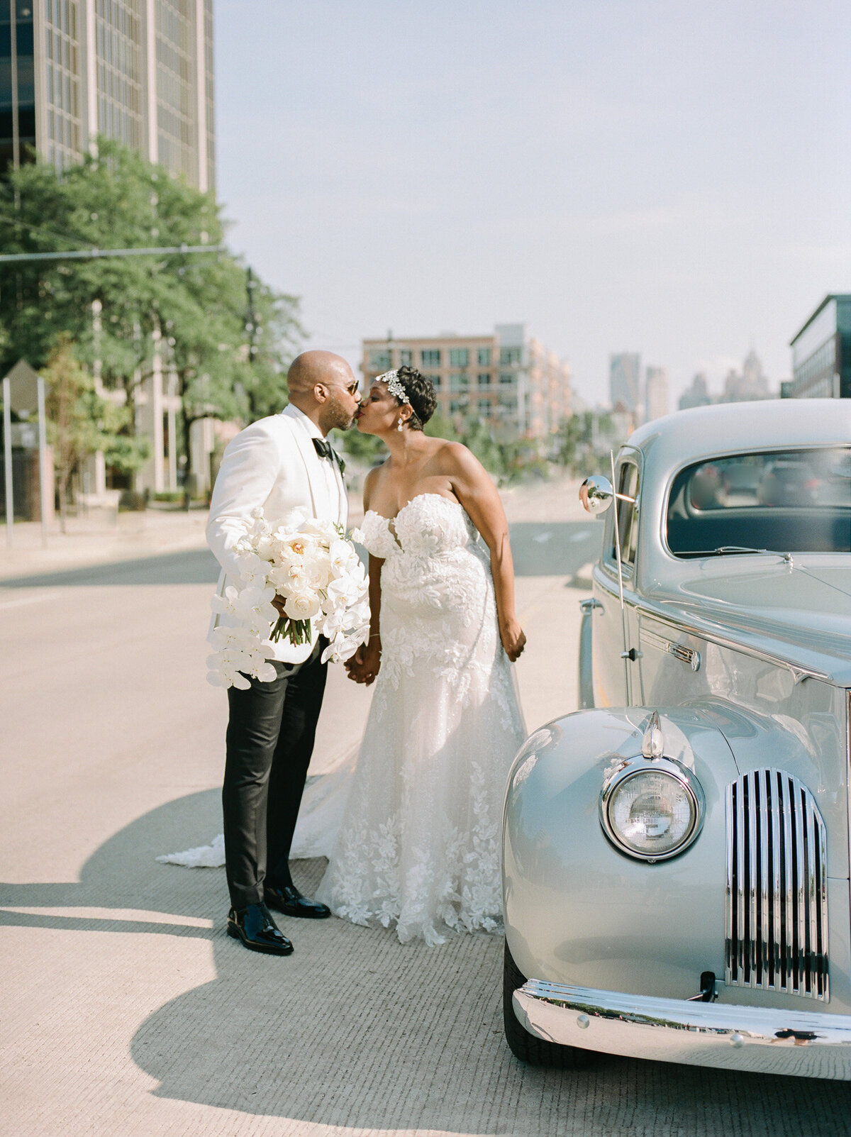 black wedding couple with vintage packard wedding car in Detroit, Michigan