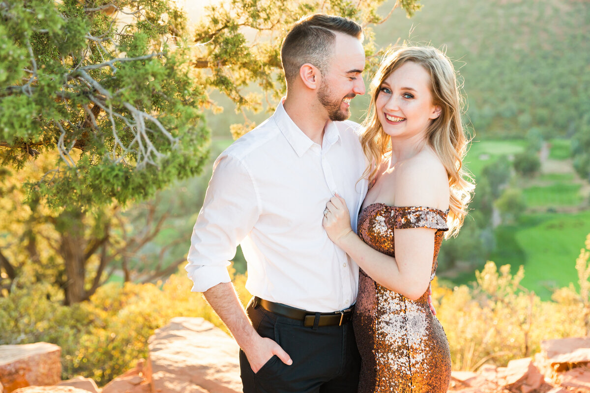 engaged couple posing together for engagement photo in Sedona
