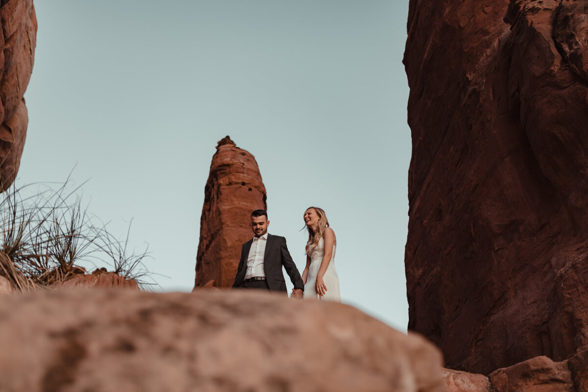 Bride laughing during Sedona elopement ceremony taken by Kollar Photography