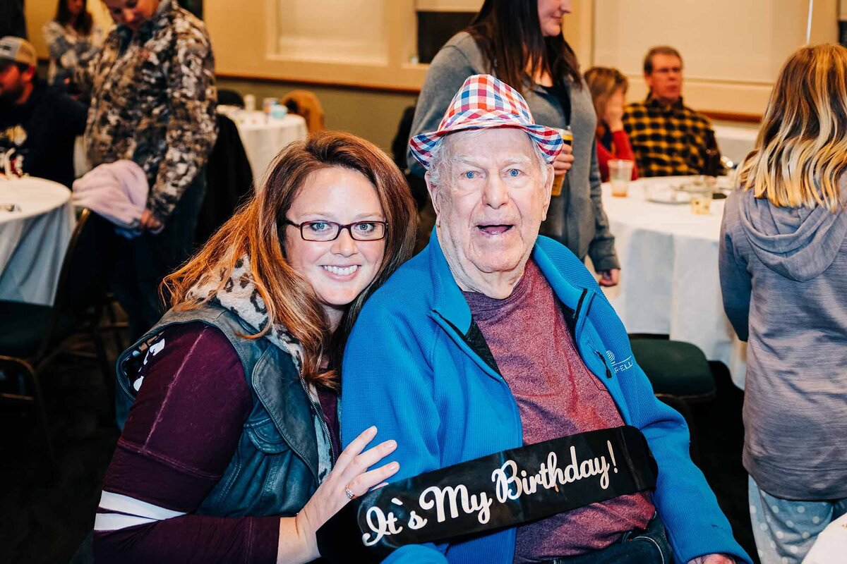 Man on his 90th birthday with granddaughter