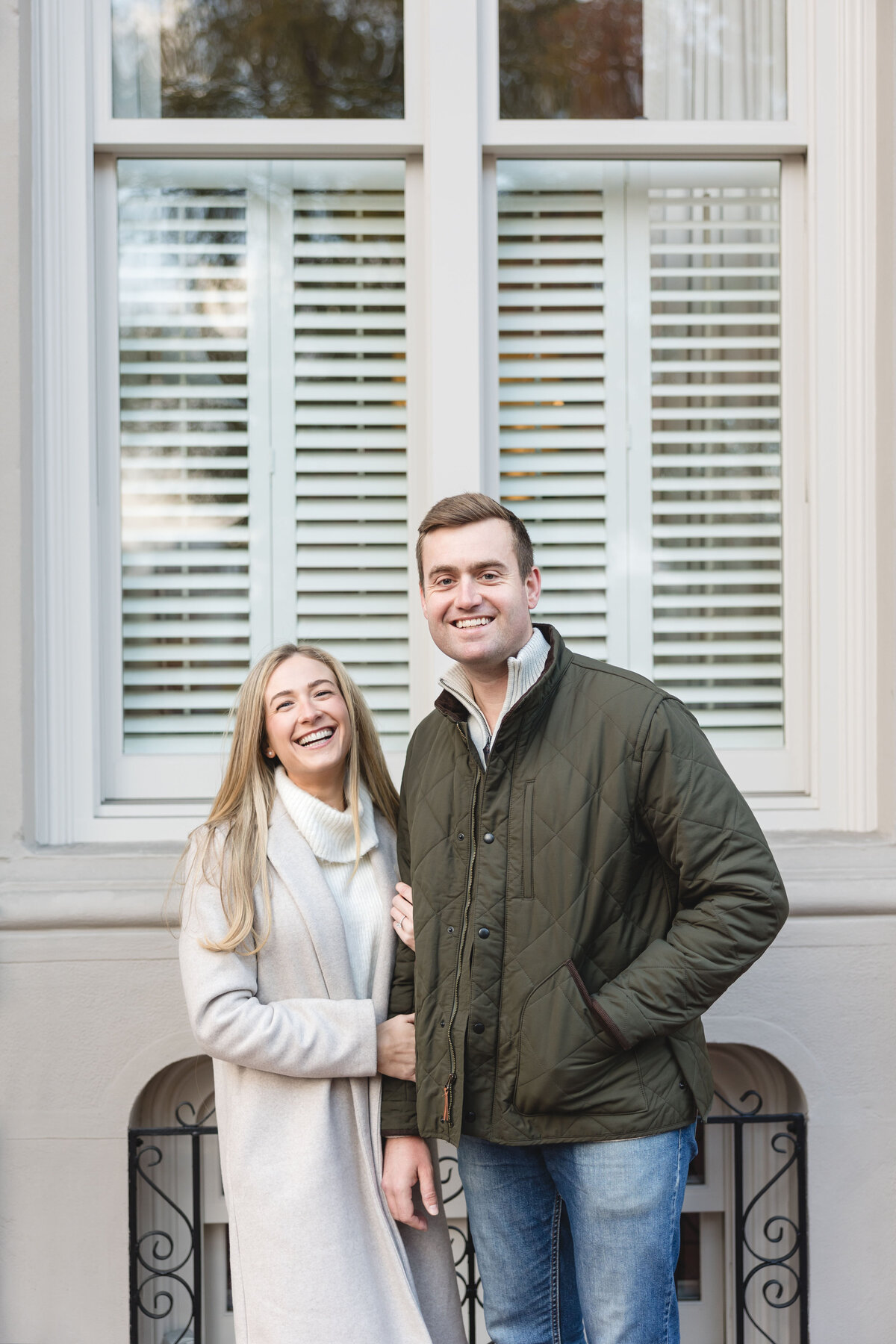 Couple laughs and enjoys their engagement session on Beacon Hill in Boston