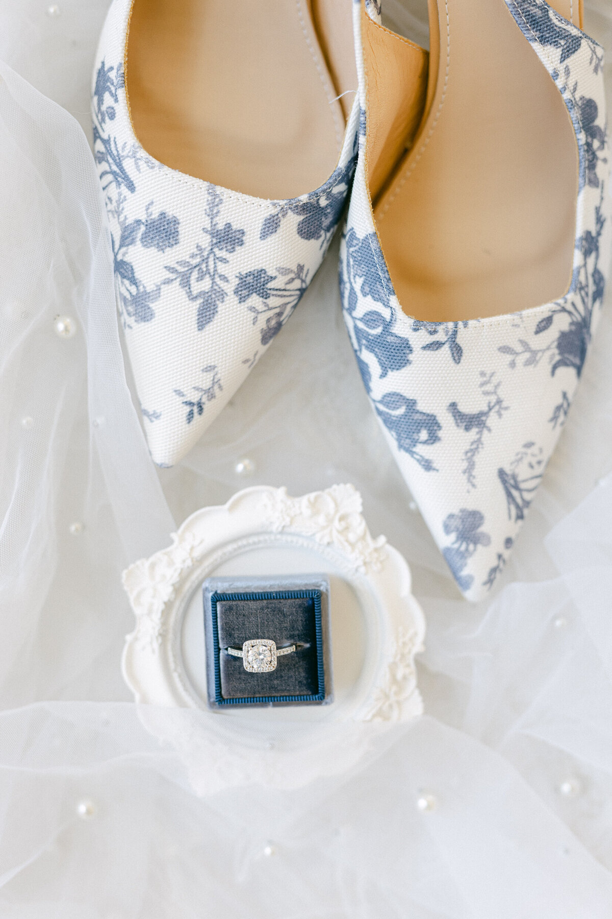 bridal shoes and an engagement ring