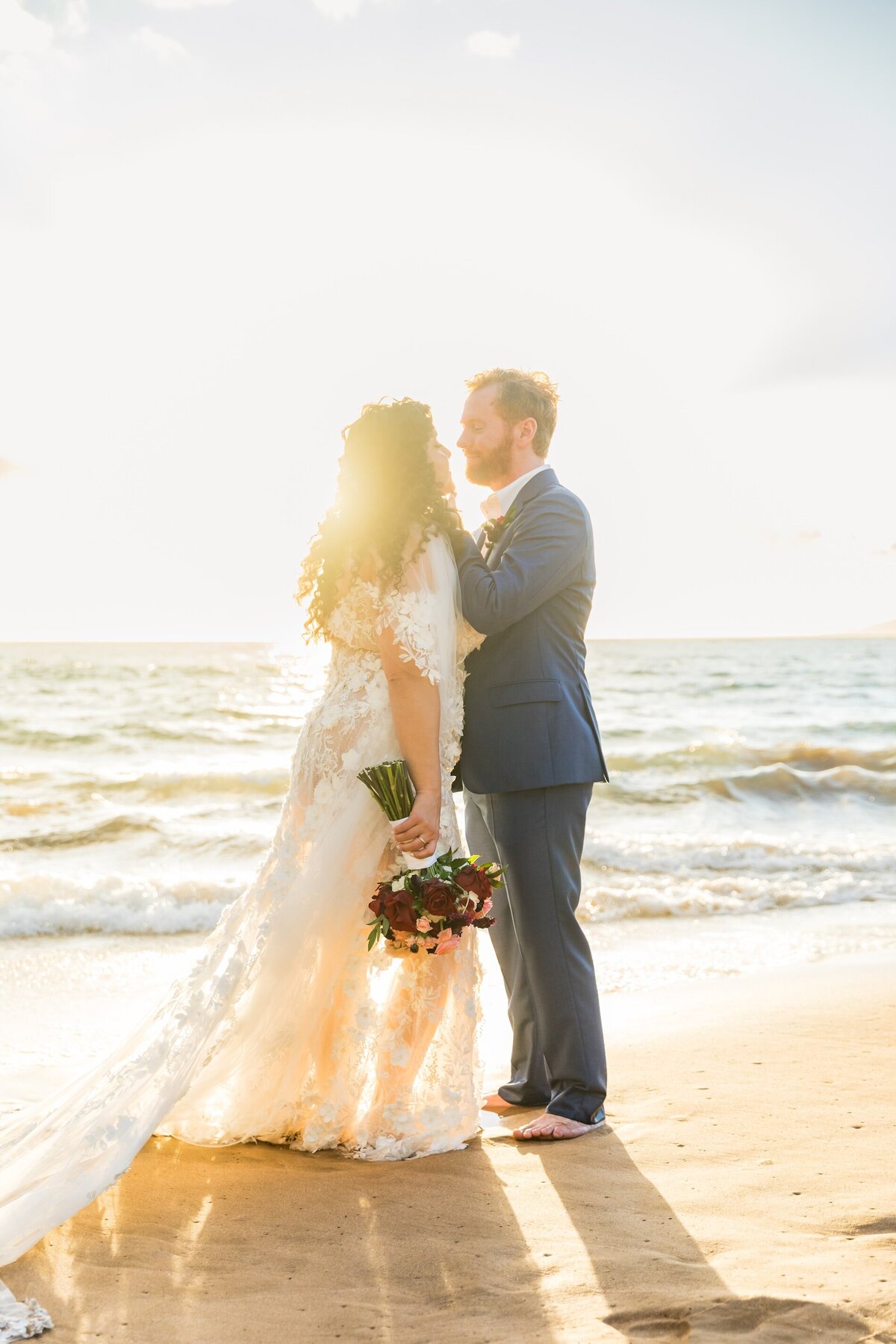Hawaii Wedding Photography during sunset glow standing on the beach